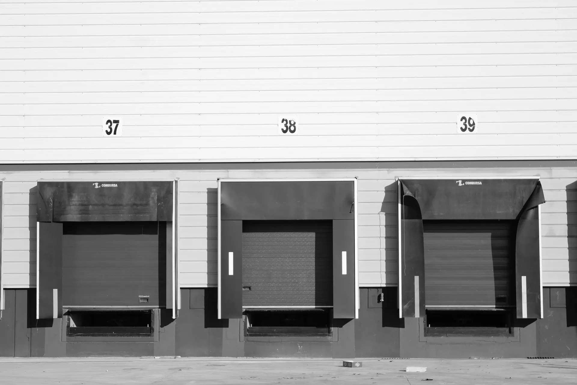 Numbered loading dock doors with weather seals at a distribution building