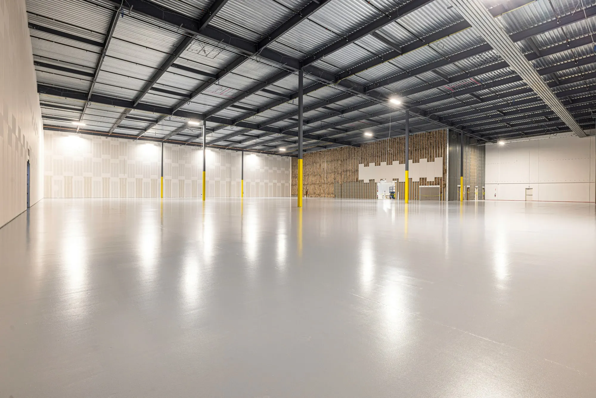 Vacant industrial building interior with a sealed concrete floor