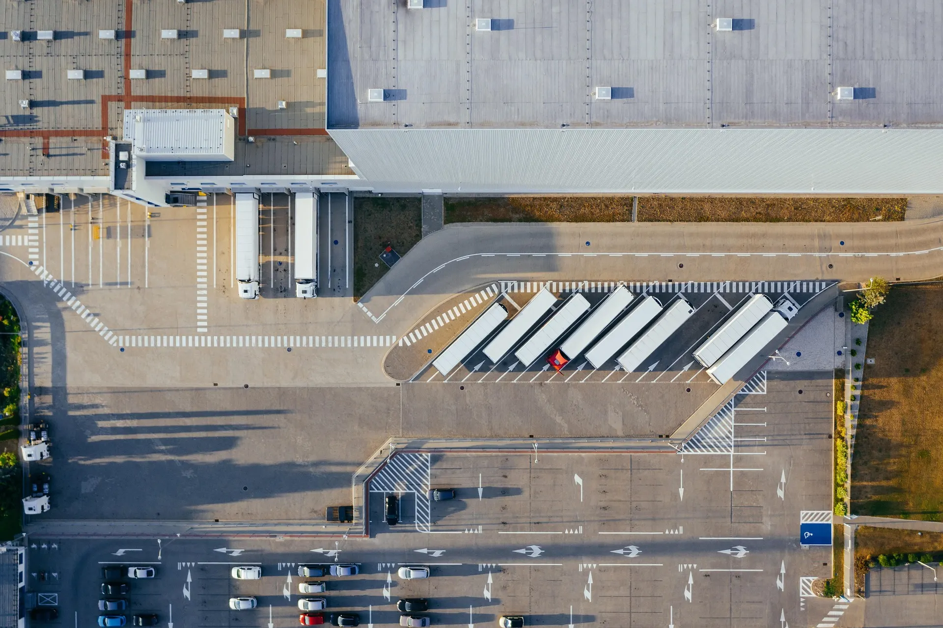 Aerial view of a distribution facility with trailers staged in the truck yard